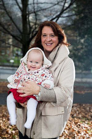 Grandparent and grandchild family portrait in woods