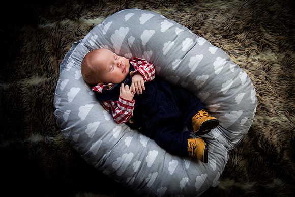 Portrait of baby sleeping on cushion