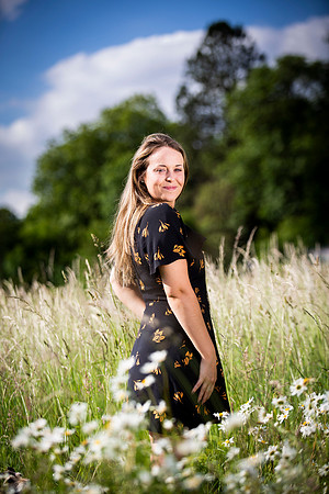 Portrait of pretty girl in fields with blue skies